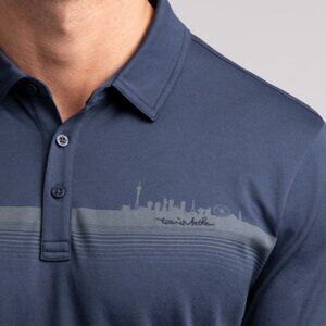 TravisMathew Men's Flaming Flamingo Vegas Skyline Blue Polo L